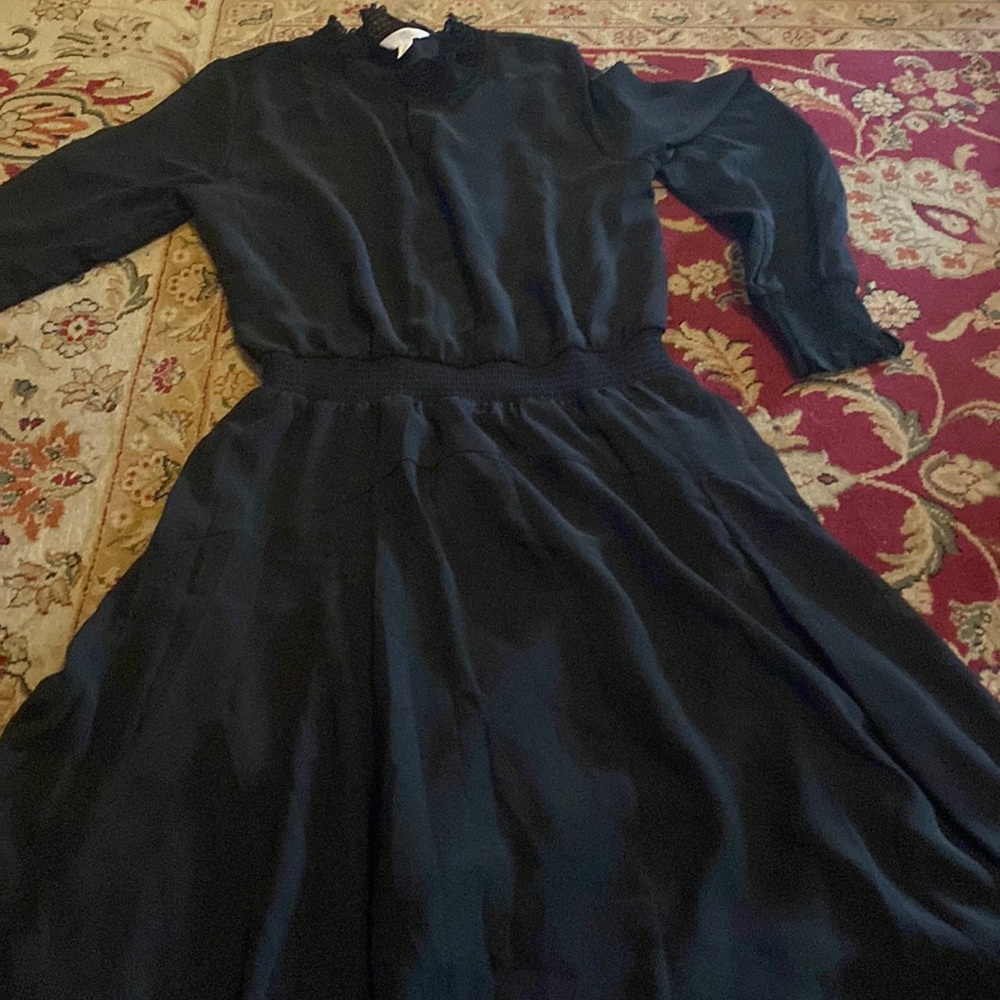 A black midi dress very elegant and sophisticated looking